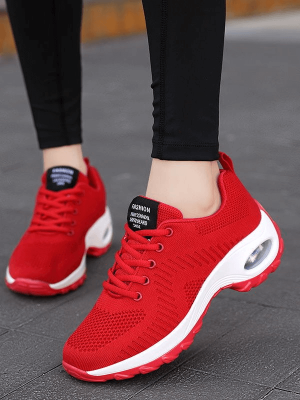 Red stylish breathable flexible women's sneakers with mesh upper and non-slip sole, perfect for active outdoor wear.